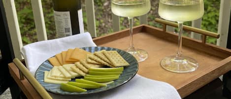 Enjoy the balcony that opens to a wooded area for your afternoon wine and cheese