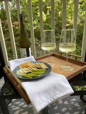 Enjoy the balcony that opens to a wooded area for your afternoon wine and cheese