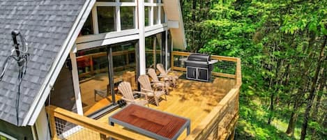 Deck with outdoor furniture and a gas grill.