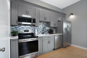 Embrace the joy of cooking in this kitchen, designed for convenience and bonding