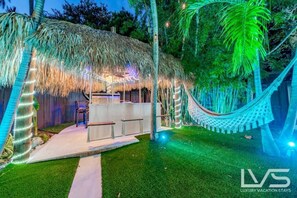 Outdoor Oasis with Heated Pool, Lighting, Magic Bowls, Waterfall, Tiki Hut, Hammock, Swings, BBQ, Outdoor Table, Sound system & More!!