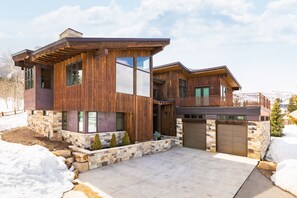 Behold the exquisite front facade of this magnificent home, where timeless elegance meets modern sophistication. With its picturesque architecture and meticulous landscaping, this residence captivates with its curb appeal.