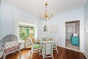 Dining Area, Doorway into Kitchen and Back Enclosed Patio with Laundry