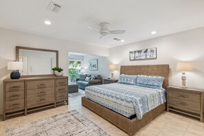 Master Bedroom with Sitting Area Featuring a Sleeper Sofa and Flat Screen Smart TV (King Bed)