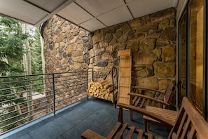 Private Patio offering courtyard and mature pine tree views.