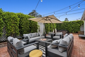 Private patio space with firepit and jacuzzi