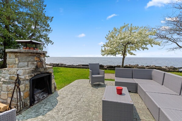 Enjoy conversation and stargazing by the cozy outdoor fireplace!
