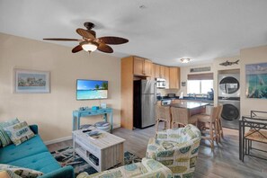 Living Room with Queen sleeper sofa; Large Kitchen Island; Dining Table