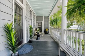 Entrance through the front door leading to the lower porch