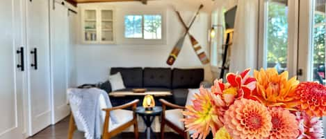 French doors lead out to the deck and the interior is cozy and inviting.