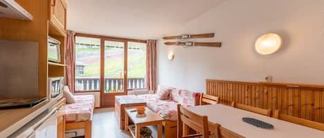 Bright living room with a view from the ski runs