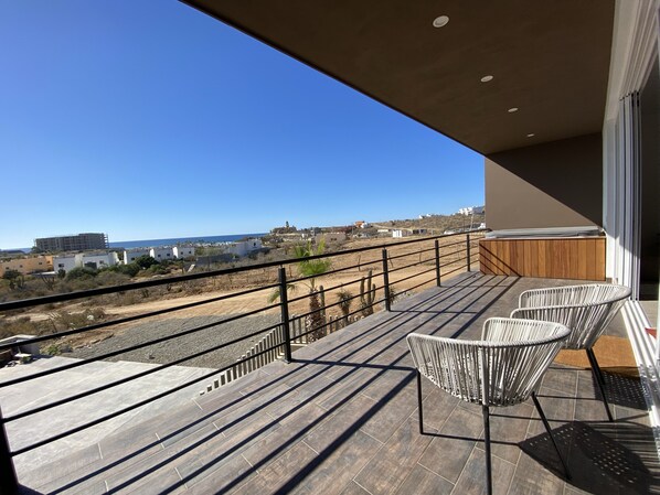 Terrace off living room, hot tub and ocean/beach view; sitting chairs and lounge