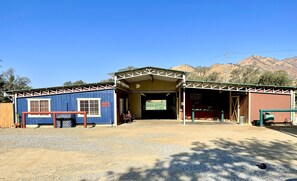 Front view of The Hideout and horse barn 