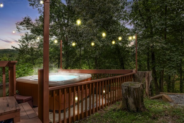 Relax in the Hot Tub and enjoy the mood set by the string lights at night!