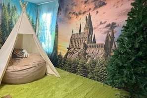 Kids upstairs playroom comes with a beanbag and tent!