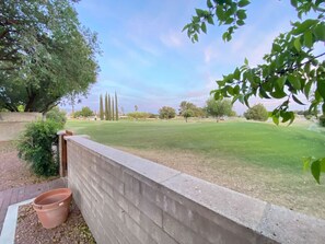 Rolling Hills Golf Course just beyond the backyard offers beautiful and peaceful views