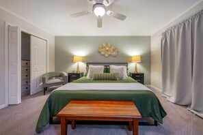 Primary bedroom with king bed, en-suite bathroom, and large closets