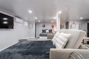 Basement Studio Apartment's Pullout Sofa 6.5 ft Ceiling