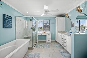 After a fun day on the beach, sink into the soaker tub with a glass of wine.