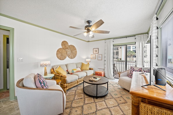 This comfy living room offers space for everyone to gather!
