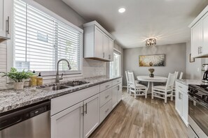 Kitchen with granite countertops and stainless-steel appliances