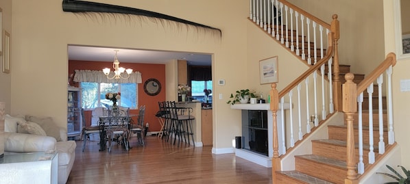 Entry view into the house. Front room with dining room in the back.