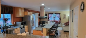 Looking at the kitchen and family room from the dining room.