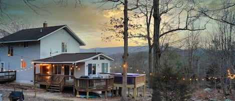 View of the master bedroom , porch, hot tub and the Mountain View.