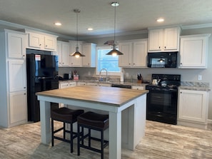 Large, open kitchen with island/seating.