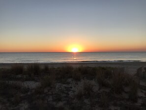 Morning sunrise on beach front decl