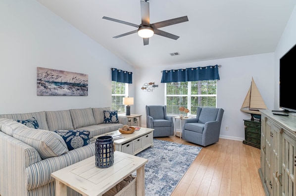 Relax in this coastal themed living area