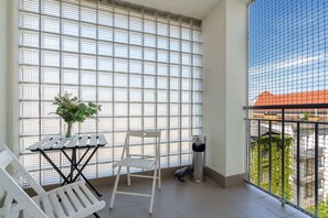 View of the balcony with garden furniture.
