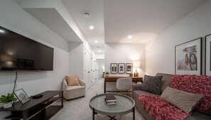 Living room with 55" Smart TV and pull out sofa