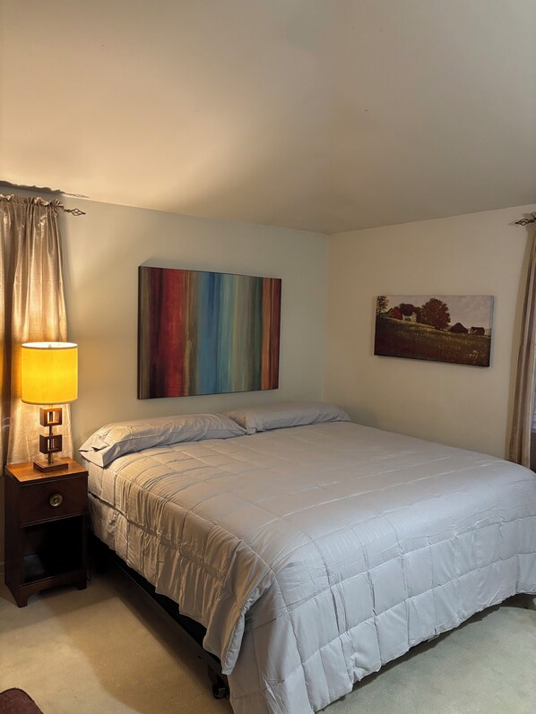 Master bedroom with king sized bed. 