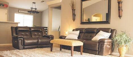 Living room with 2 leather couches