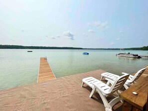 Dock and loungers on the water-level deck.