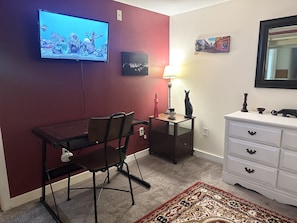 Mounted TV to help you sleep. The adjacent living room has a 50 inch as well.