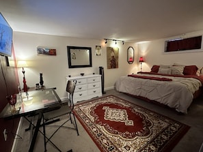 Oversized king bedroom with desk to conduct work on the go. 32” Streaming TV.