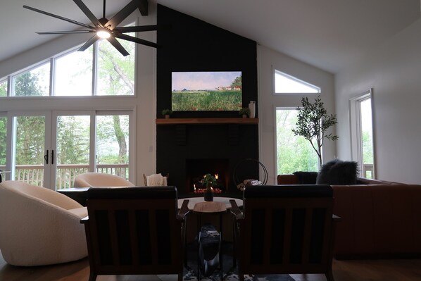 Upstairs Living Room featuring a walkout to the upstairs deck. 