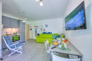 The kitchen with living room