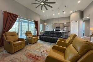 The main living area is an open concept with dramatic ceilings w/access to 2nd a story balcony.