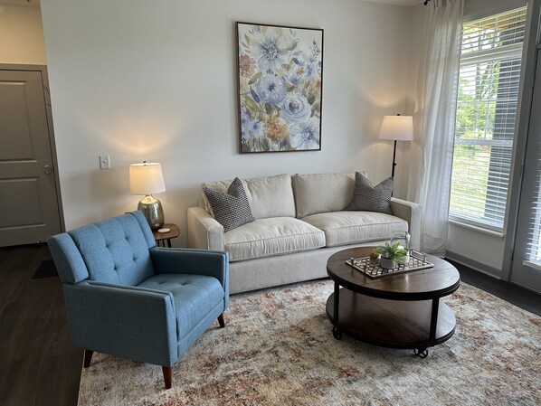 Beautiful living room featuring a premium Arhaus sofa! No Walmart futons here. :)