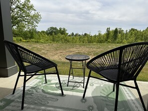 Private patio with modern stylish seating and nature views 