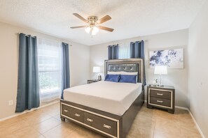 Queen bedroom with smart TV. Sparkling clean master en-suite with tub and shower is fully stocked with fresh towels, shampoo, body wash, hand soap.