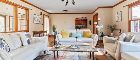 The inviting living room has plenty of seating for a group. 