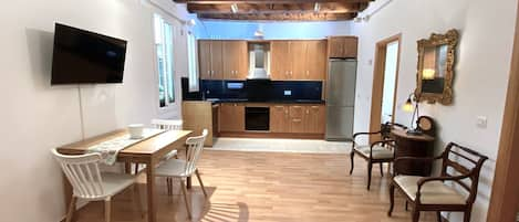 Spacious cosy living room with beautiful original wooden beams