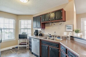 Bright spacious kitchen with microwave and dishwasher