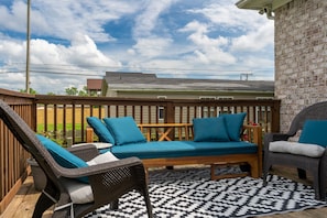 Patio with outdoor seating and gas BBQ grill