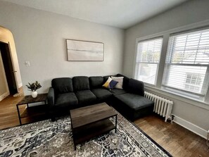 Living Room: Our living room is set up to make sure you and your loved ones have a good time. It includes a cozy 5-seater sofa and a coffee table.