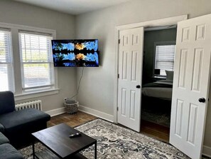 Living Room: Plus, there's a large smart TV for watching your favorite movies and shows.